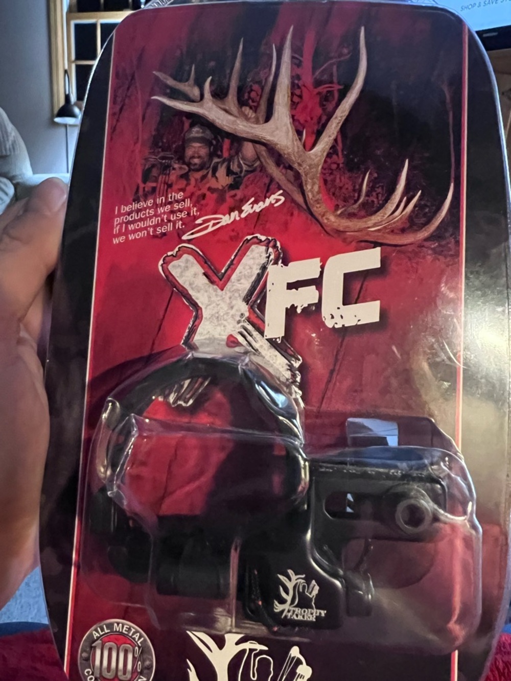 - Black Trophy Taker XFC Fall-Away Rest for compound bows.